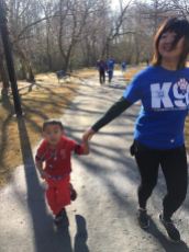 mother with son running for supporting K-9
